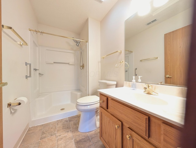 bathroom featuring vanity, toilet, and walk in shower