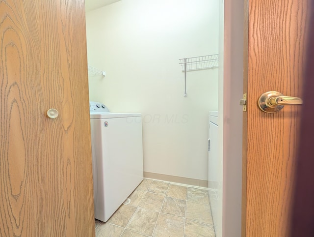 laundry area with washing machine and dryer