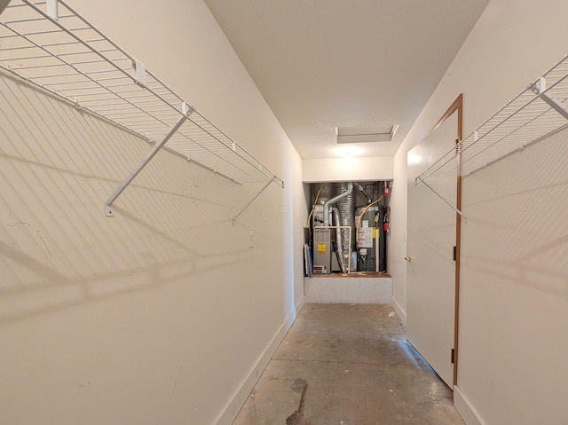 388 Virginia Ct, Pataskala, OH 43062 - hall featuring heating unit, concrete floors, and attic access