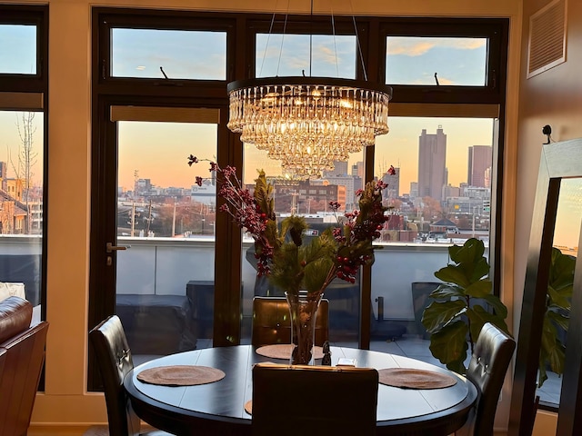 dining area featuring a notable chandelier