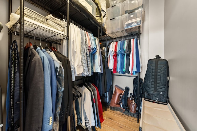 walk in closet featuring hardwood / wood-style flooring