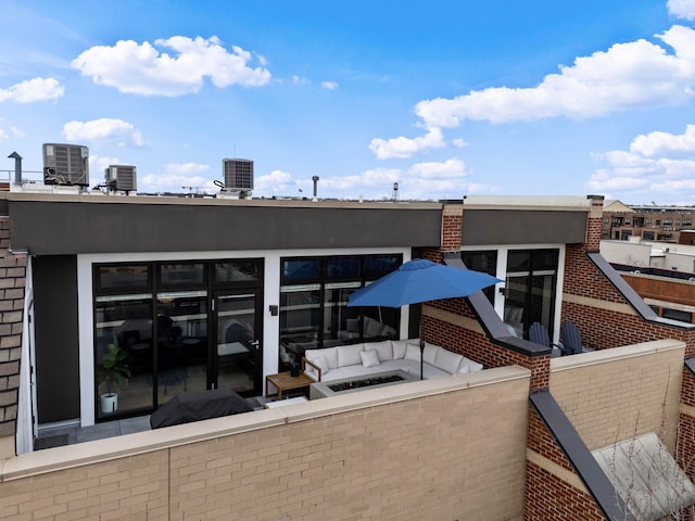 rear view of house featuring an outdoor living space and central AC