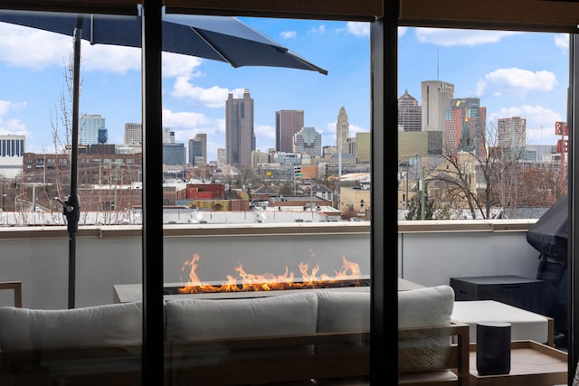 interior space with exterior fireplace and multiple windows