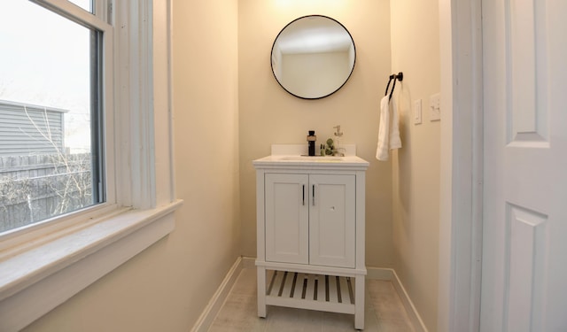 bathroom with tile patterned flooring and vanity