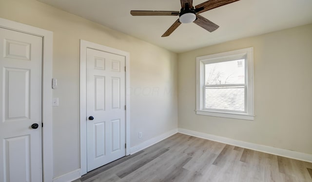 unfurnished bedroom with light hardwood / wood-style floors and ceiling fan