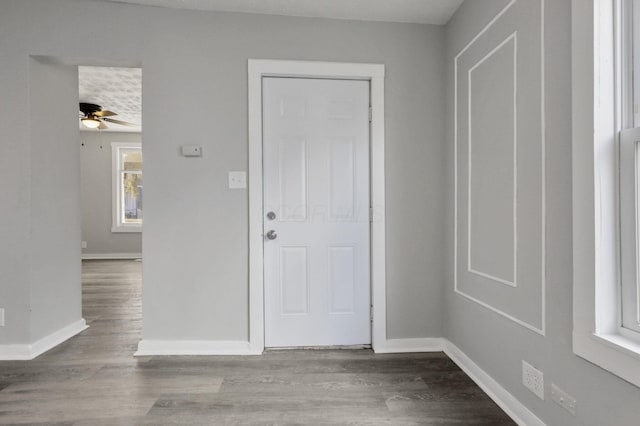 entrance foyer with ceiling fan and light hardwood / wood-style flooring