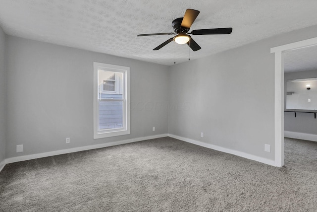 unfurnished room featuring carpet flooring, a textured ceiling, and ceiling fan