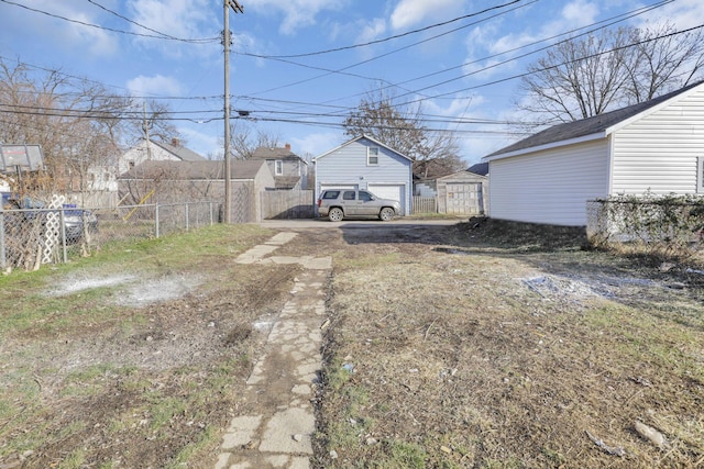 view of yard with an outdoor structure and a garage