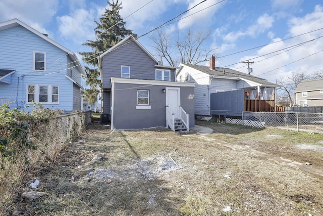 rear view of property with central air condition unit