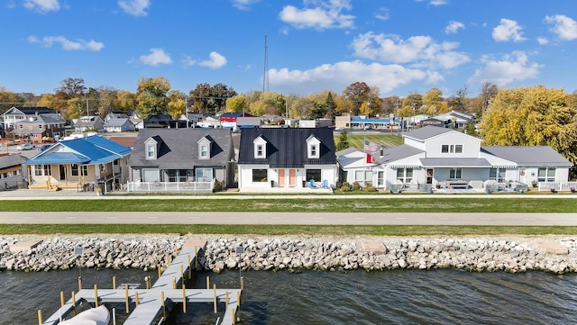 back of house featuring a water view