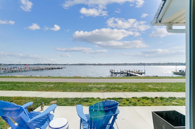 exterior space with a water view and a boat dock