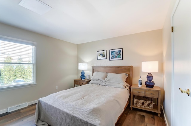 bedroom featuring dark hardwood / wood-style flooring