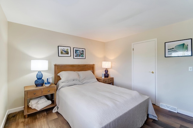 bedroom featuring dark wood-type flooring