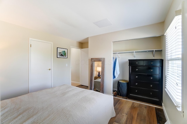 bedroom with a closet and dark hardwood / wood-style flooring