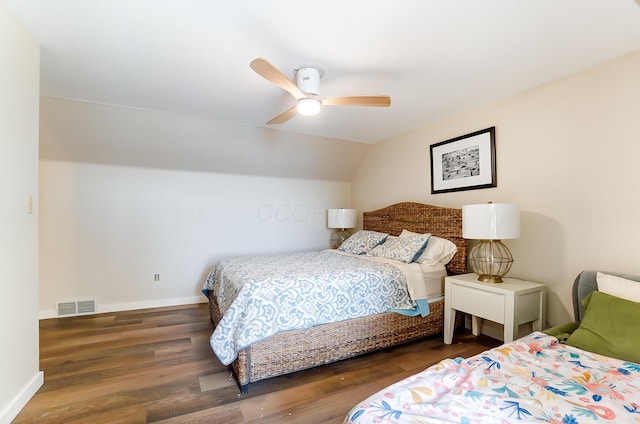 bedroom with ceiling fan, dark hardwood / wood-style flooring, and lofted ceiling