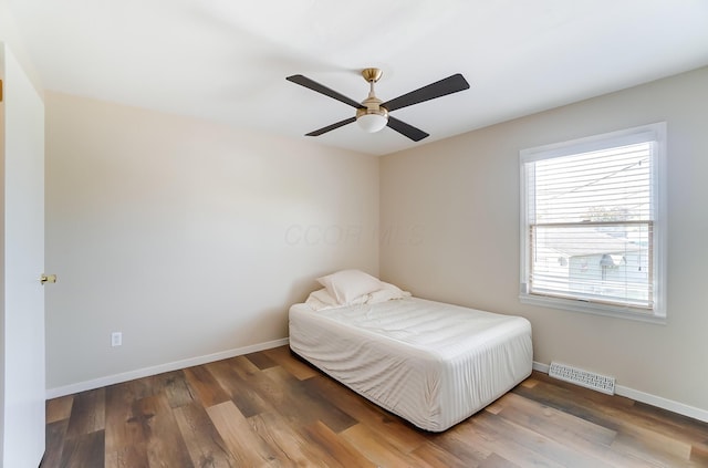 bedroom featuring ceiling fan and wood-type flooring