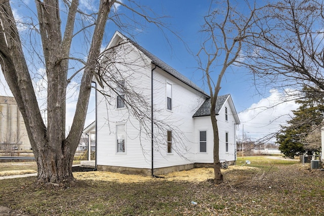 view of side of home featuring central AC unit