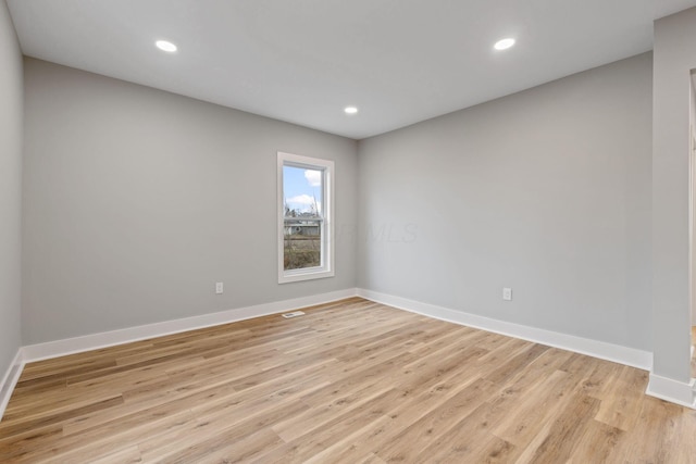 unfurnished room featuring light hardwood / wood-style flooring