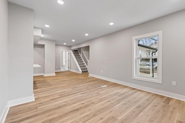 basement featuring light hardwood / wood-style flooring