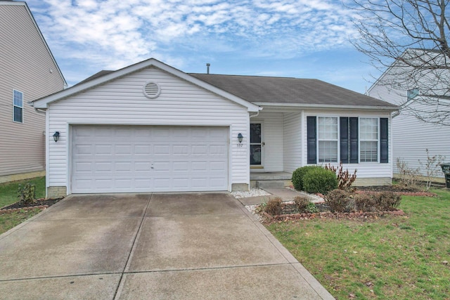 ranch-style house featuring a garage and a front yard