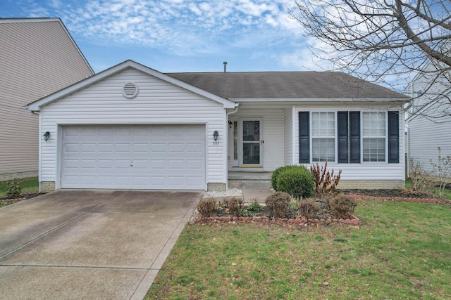 ranch-style house featuring a garage and a front lawn