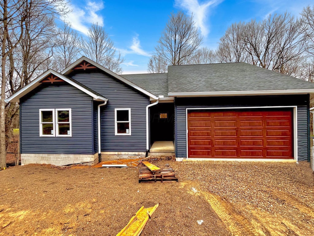 single story home with a garage