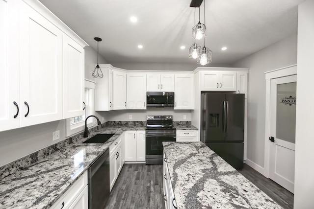 kitchen with sink, pendant lighting, stainless steel appliances, white cabinets, and light stone countertops