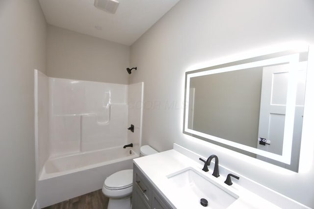 full bathroom featuring shower / bath combination, vanity, toilet, and hardwood / wood-style floors