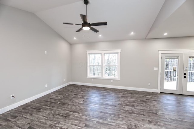 spare room featuring french doors, lofted ceiling, dark hardwood / wood-style flooring, and plenty of natural light