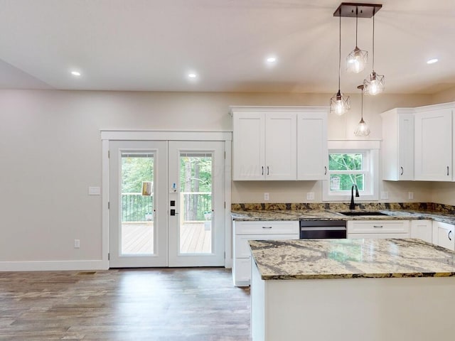783 Crestrose Dr, Howard, OH 43028 - kitchen featuring a sink, dishwasher, french doors, light wood-type flooring, and light stone counters
