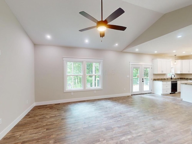 783 Crestrose Dr, Howard, OH 43028 - unfurnished living room with ceiling fan, vaulted ceiling, a sink, light wood-type flooring, and baseboards