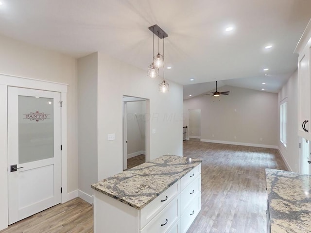 783 Crestrose Dr, Howard, OH 43028 - kitchen with light wood-style floors, white cabinets, light stone counters, a ceiling fan, and recessed lighting