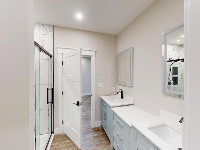 783 Crestrose Dr, Howard, OH 43028 - full bathroom featuring double vanity, a shower stall, wood finished floors, baseboards, and recessed lighting