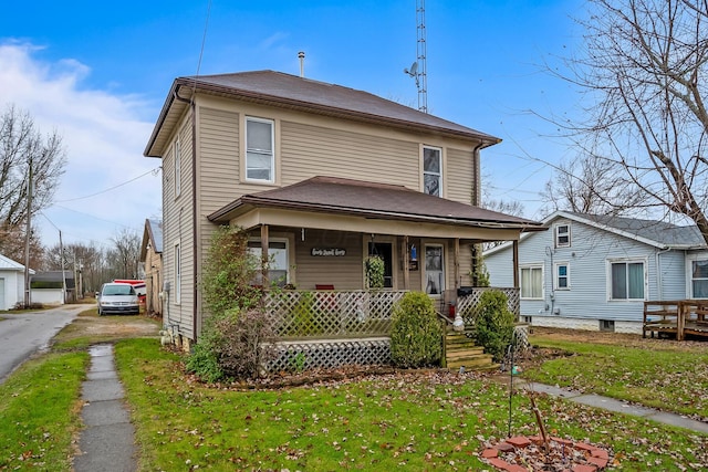 view of front of home featuring covered porch and a front yard