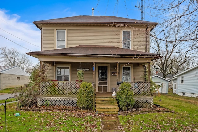 view of front of property featuring a front lawn and covered porch