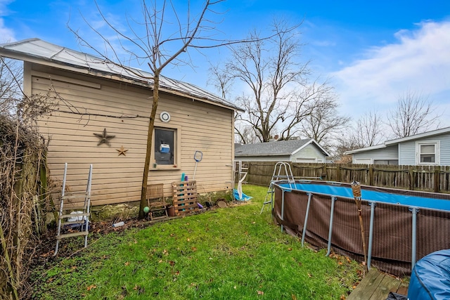 view of yard with a fenced in pool