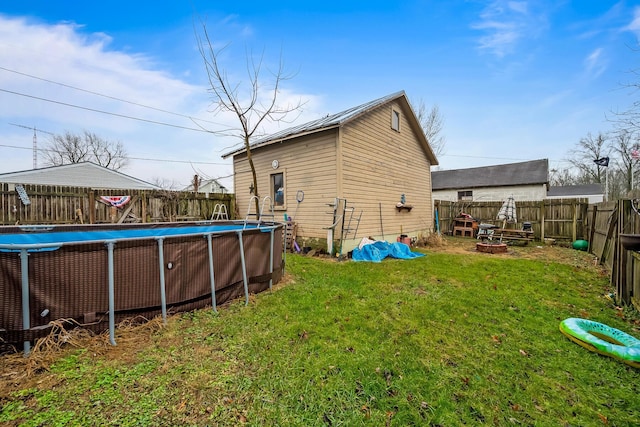 exterior space with a fenced in pool