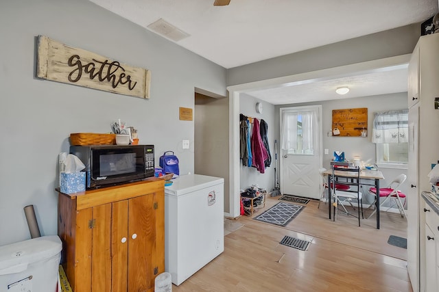 interior space with light hardwood / wood-style floors