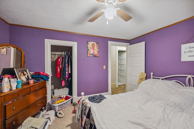 bedroom featuring a closet, light colored carpet, ceiling fan, and ornamental molding