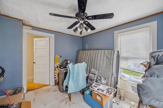 bedroom with a textured ceiling, ceiling fan, and crown molding