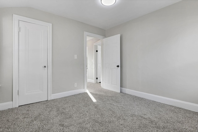 unfurnished bedroom featuring carpet and a closet