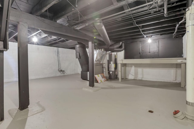 basement featuring gas water heater and heating unit