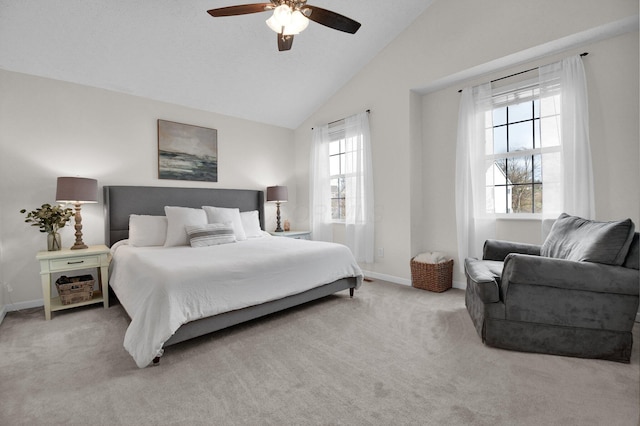 bedroom featuring ceiling fan, light colored carpet, and vaulted ceiling