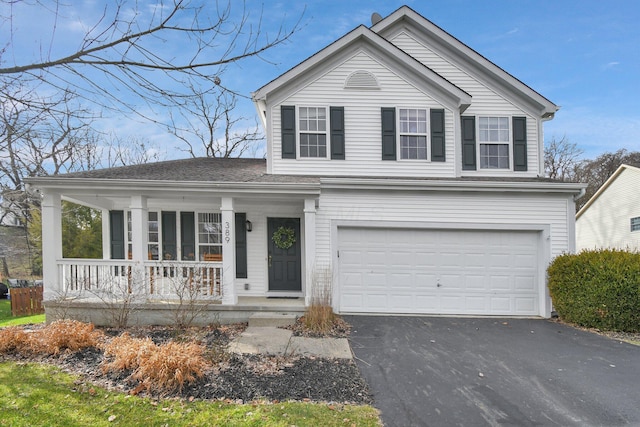 front facade with covered porch and a garage