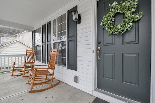 view of exterior entry with covered porch