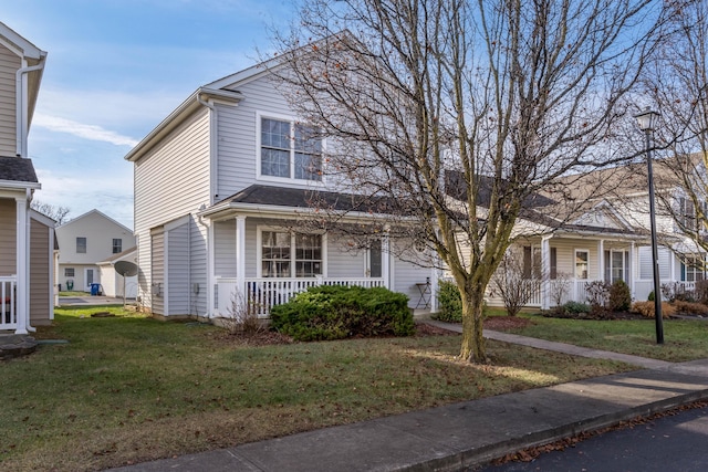 front of property with a porch and a front lawn