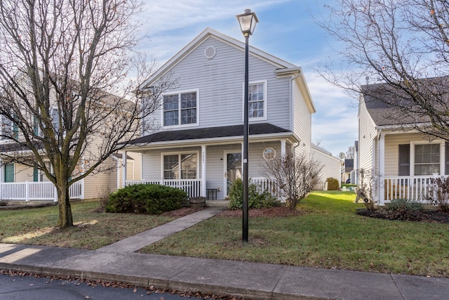 view of property with covered porch and a front yard