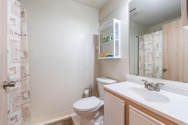 full bathroom with toilet and vanity