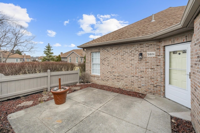 view of patio featuring fence