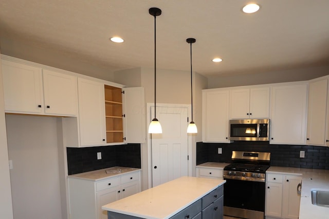 kitchen featuring stainless steel appliances, open shelves, and white cabinets